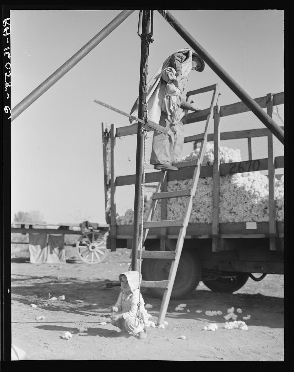 [Untitled photo, possibly related to: Cotton weigher. Southern San Joaquin Valley, California]. Sourced from the Library of…