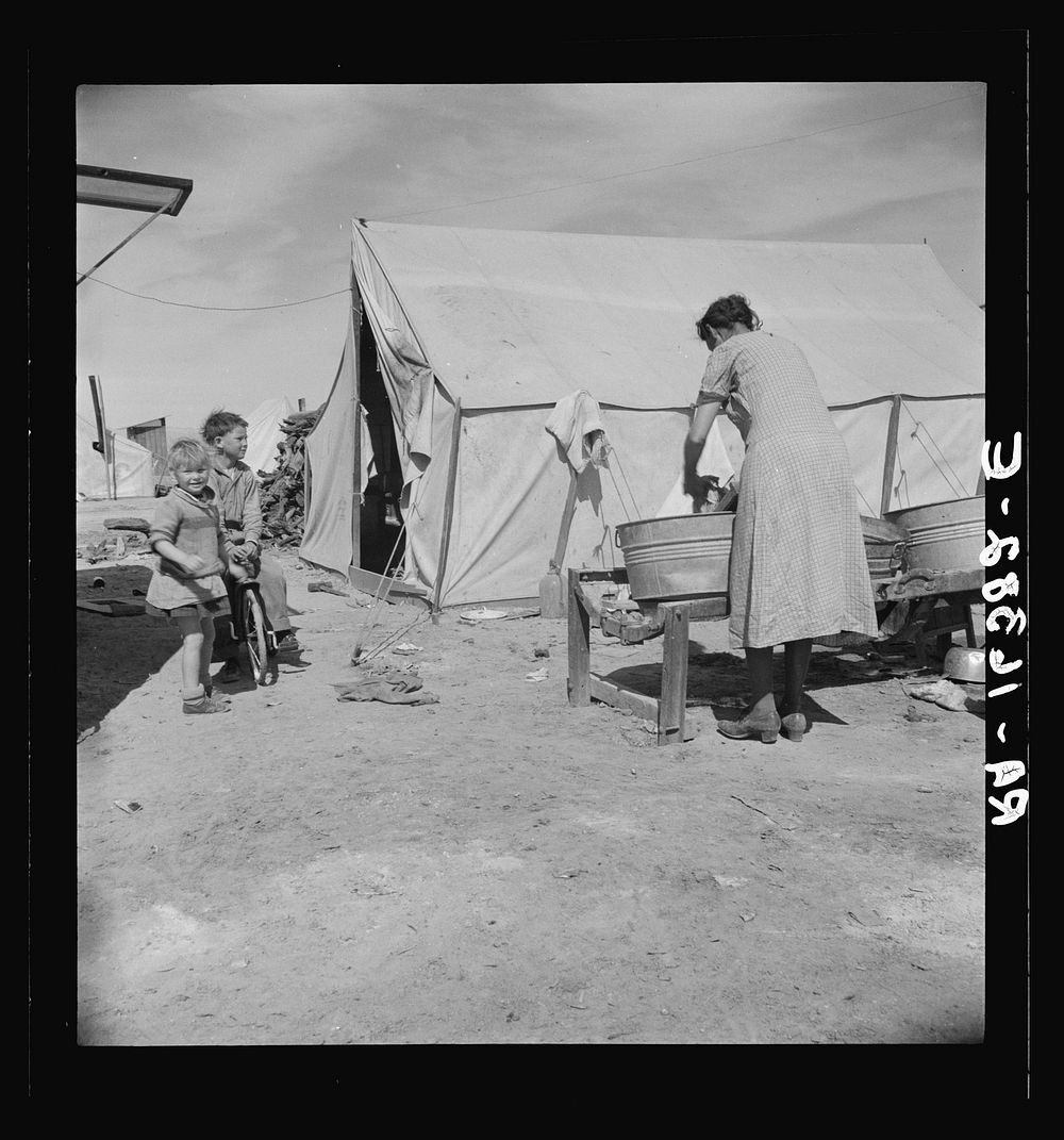 Washing facilities for families in migratory pea pickers' camp. Imperial Valley, California. Mostly Oklahomans and Texans.…
