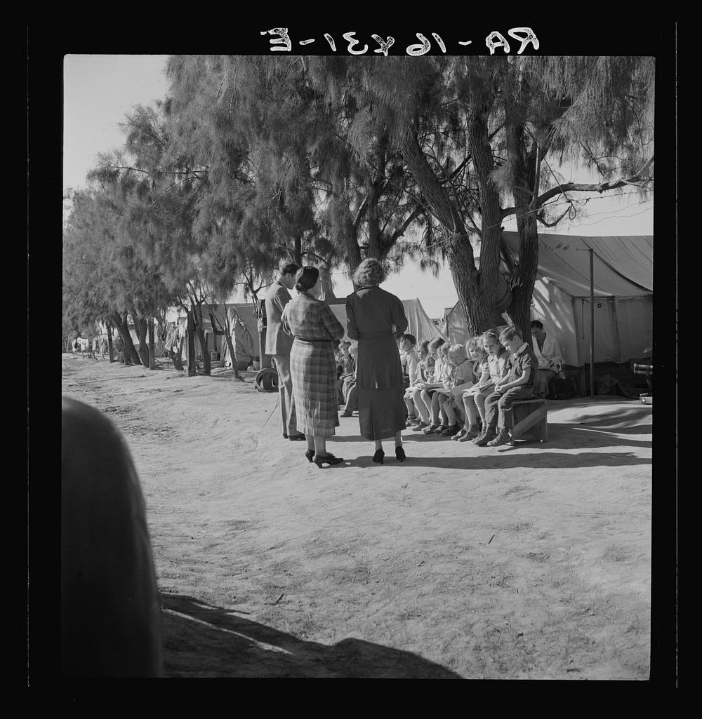 Sunday school for migrant children in a potato pickers' camp. Kern County, California. Sourced from the Library of Congress.