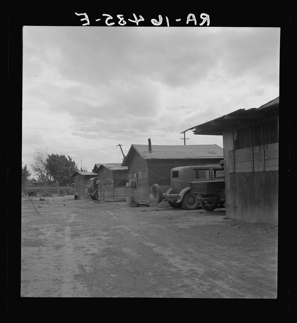 Slums of East El Centro, California. Housing for Mexican field workers. They rent for eight dollars a month. Imperial…