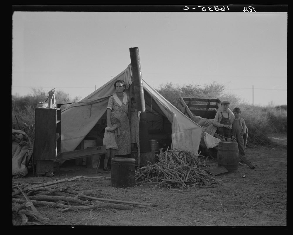 Unemployed family from the Rio Grande Valley, Texas, camped on a river bottom near Holtville, California. Sourced from the…