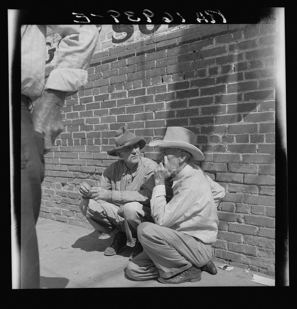Farmers on street corner. Odessa, Texas. Sourced from the Library of Congress.