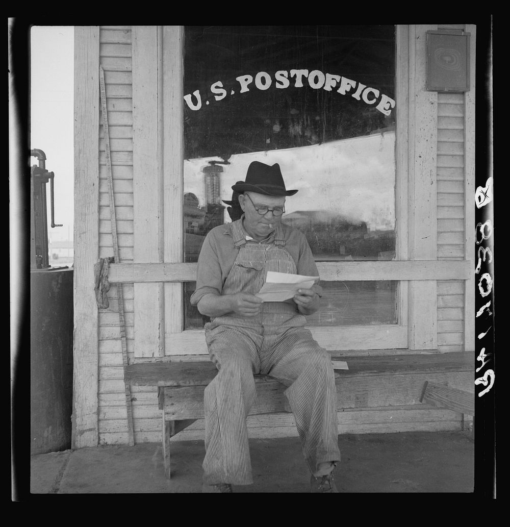 Man in front of post office. Carey, Texas. This town is fast becoming a ghost town because of mechanization of cotton and…