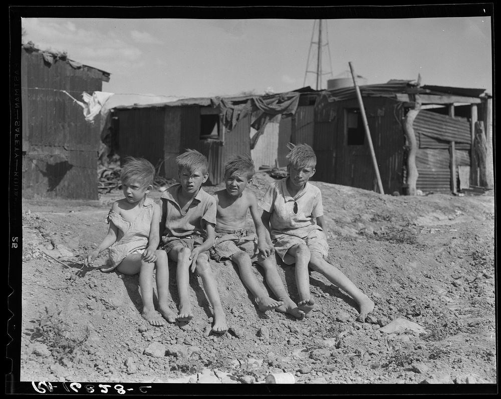 Children of migrant cotton field workers from Sweetwater, Oklahoma. Eight children in the family. Note the housing. Near…