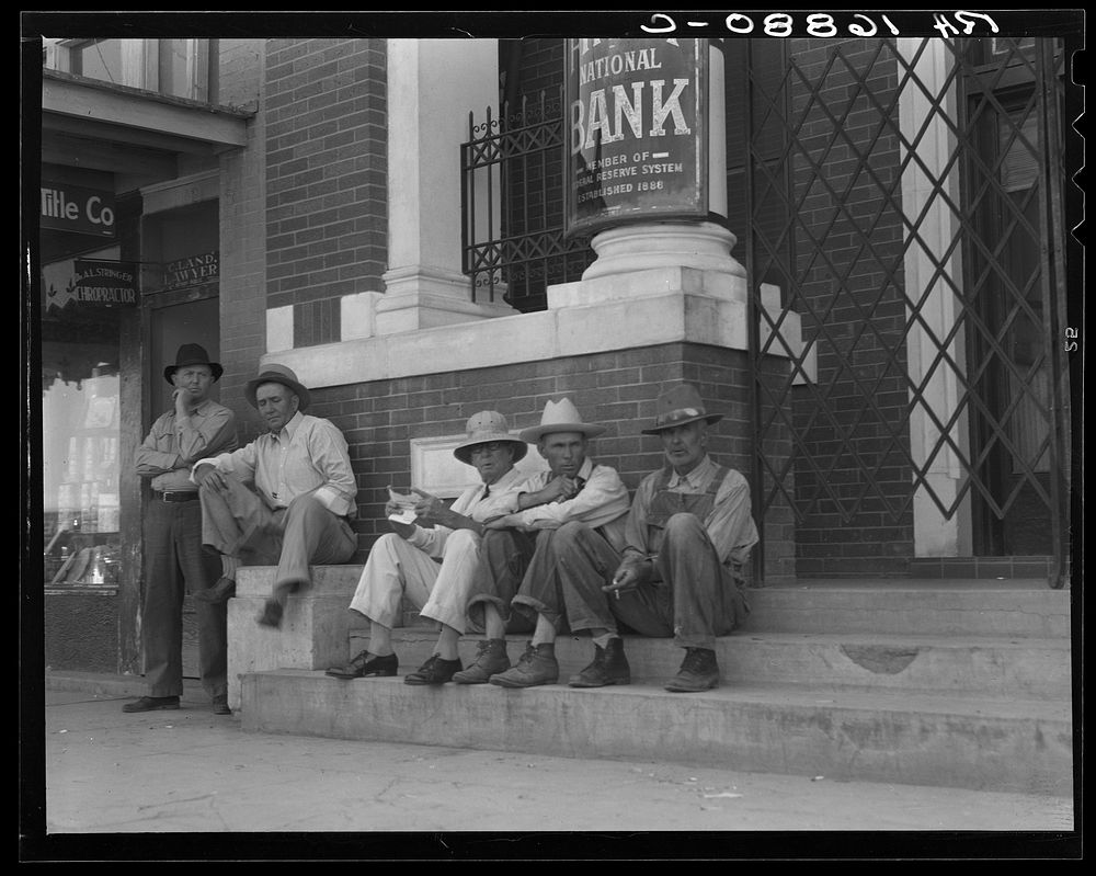 On the steps of the bank in the public square. Memphis, Texas. Sourced from the Library of Congress.