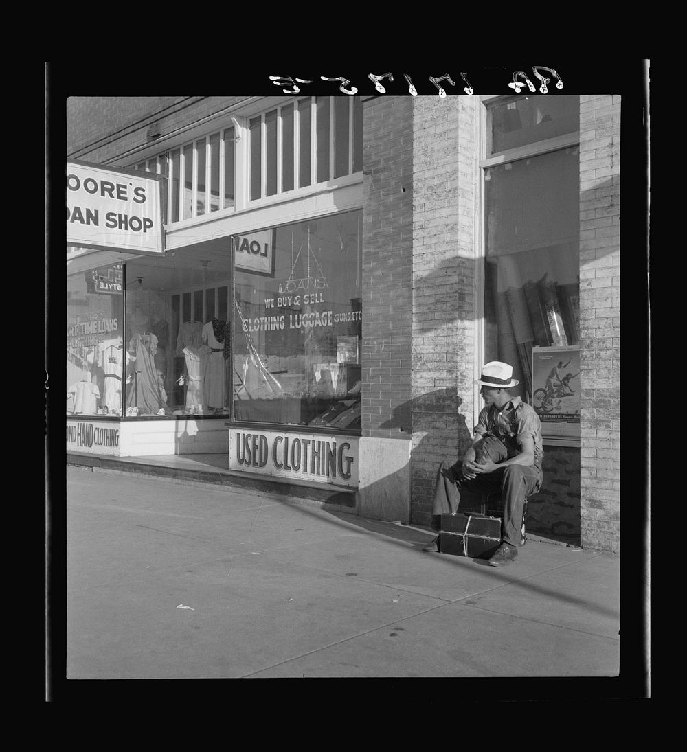 Main street storefront, Chickasaw, Oklahoma. This is a region from which hundreds of farm families have fled to the west.…