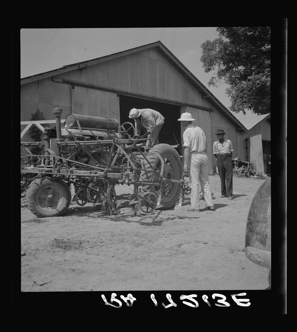 Aldridge Plantation, Mississippi. Tractor drivers are not allowed to do anything but drive tractors. Repairs are made by the…