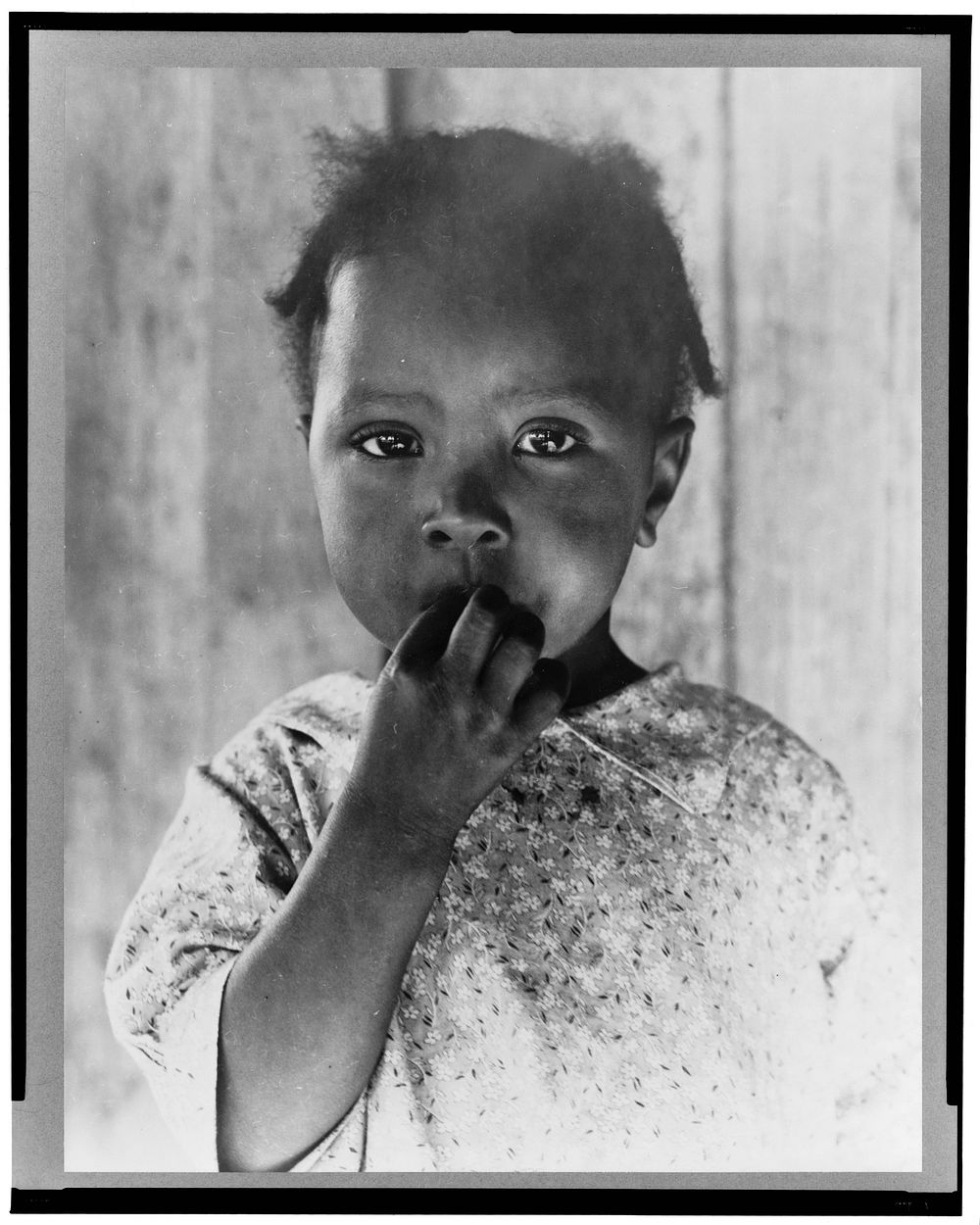 Child of former tenant farmer, now a day laborer. Ellis County, Texas by Dorothea Lange