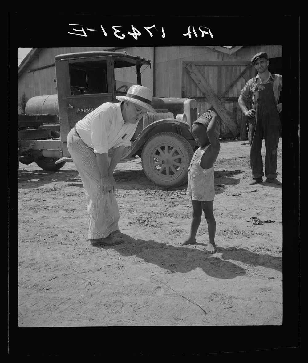 Plantation owner with one of the  plantation children. Aldridge Plantation, Mississippi by Dorothea Lange