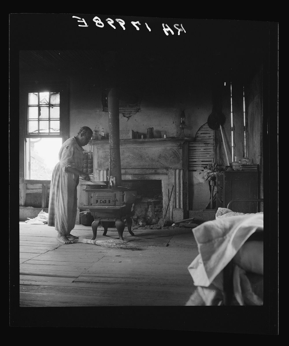 Interior of a plantation house now vacant but for two rooms occupied by an old Negro couple, tenants. Greene County, Georgia…