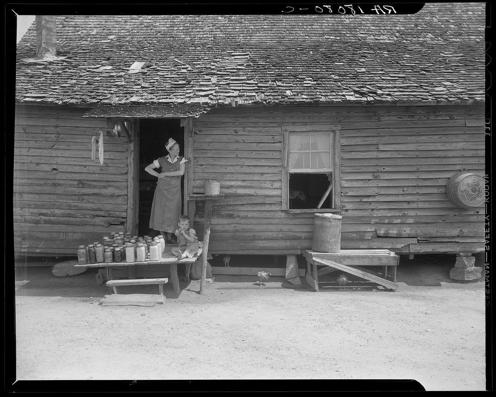 Wife and child of sharecropper near Gaffney, South Carolina. The farmer does a little day labor for his landlord. He…