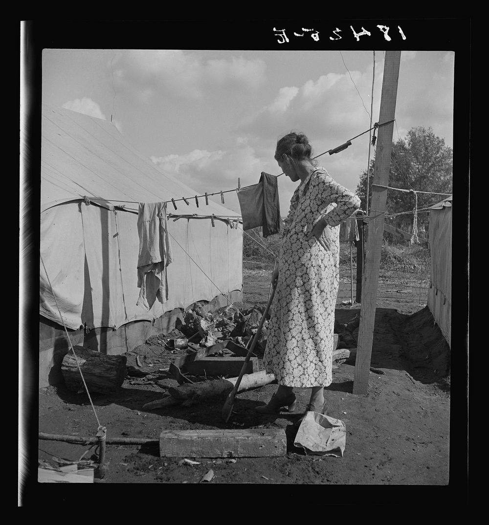 Women in auto camp for migrant citrus workers. Tulare County, California by Dorothea Lange