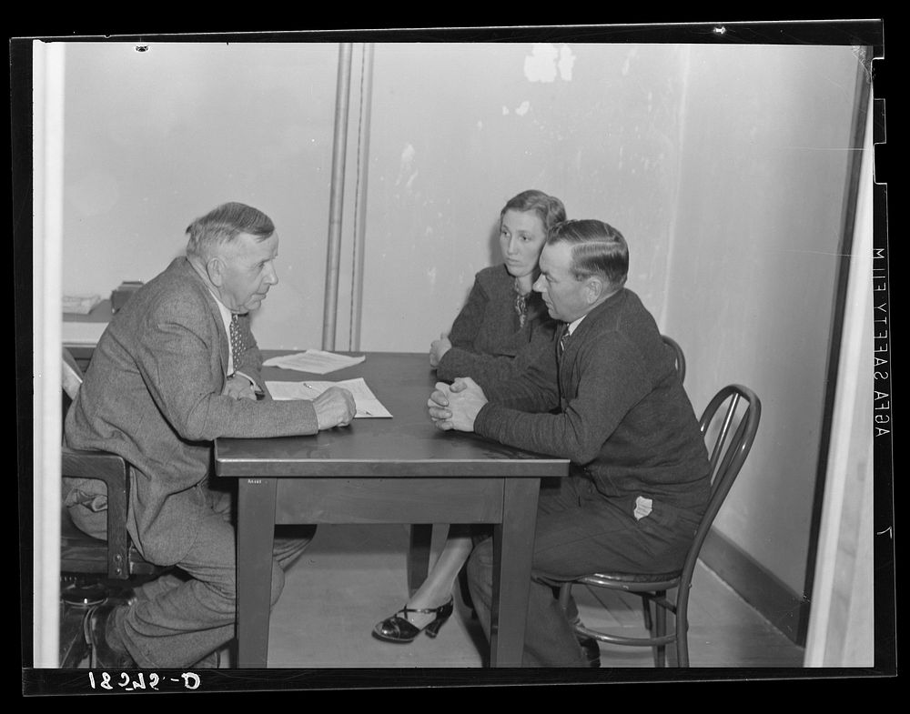 Night meeting in the Farm Security Administration (FSA) office, Rural Rehabilitation Division, Visalia, Tulare County…