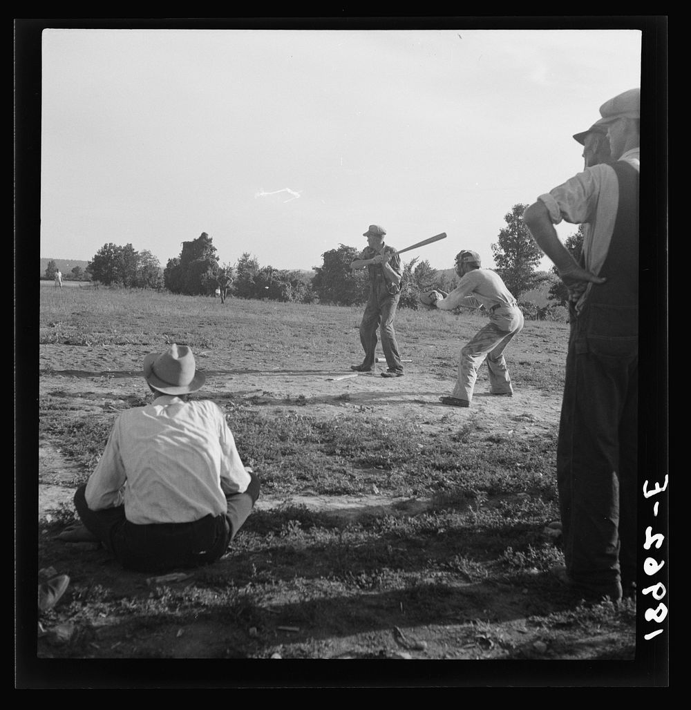 Near mountain home, northern Arkansas, on U.S. 62. Farmers' baseball game in the country. From this area many have gone to…
