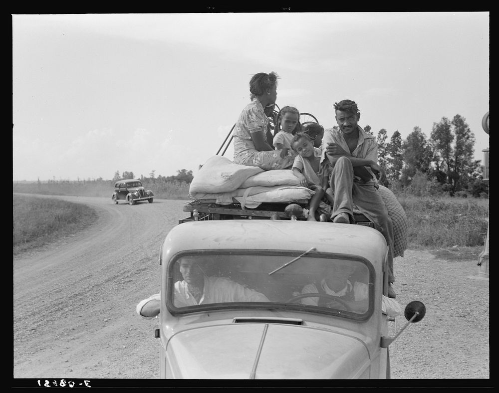 Mississippi Delta, on Mississippi highway No. 1 between Greenville and Clarksdale. Negro laborer's family being moved from…