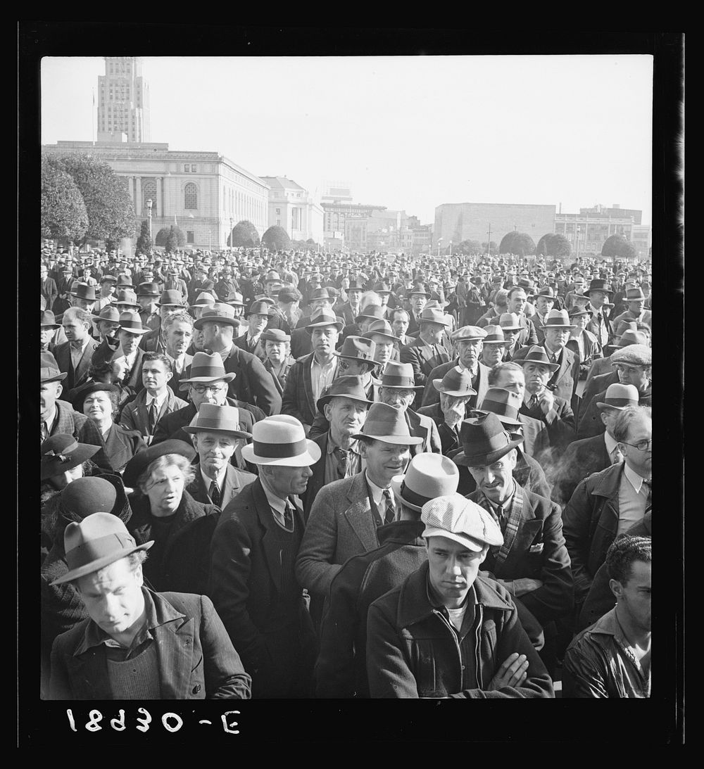 Listening to speeches at mass meeting of Works Progress Administration (WPA) workers protesting congressional cut of relief…