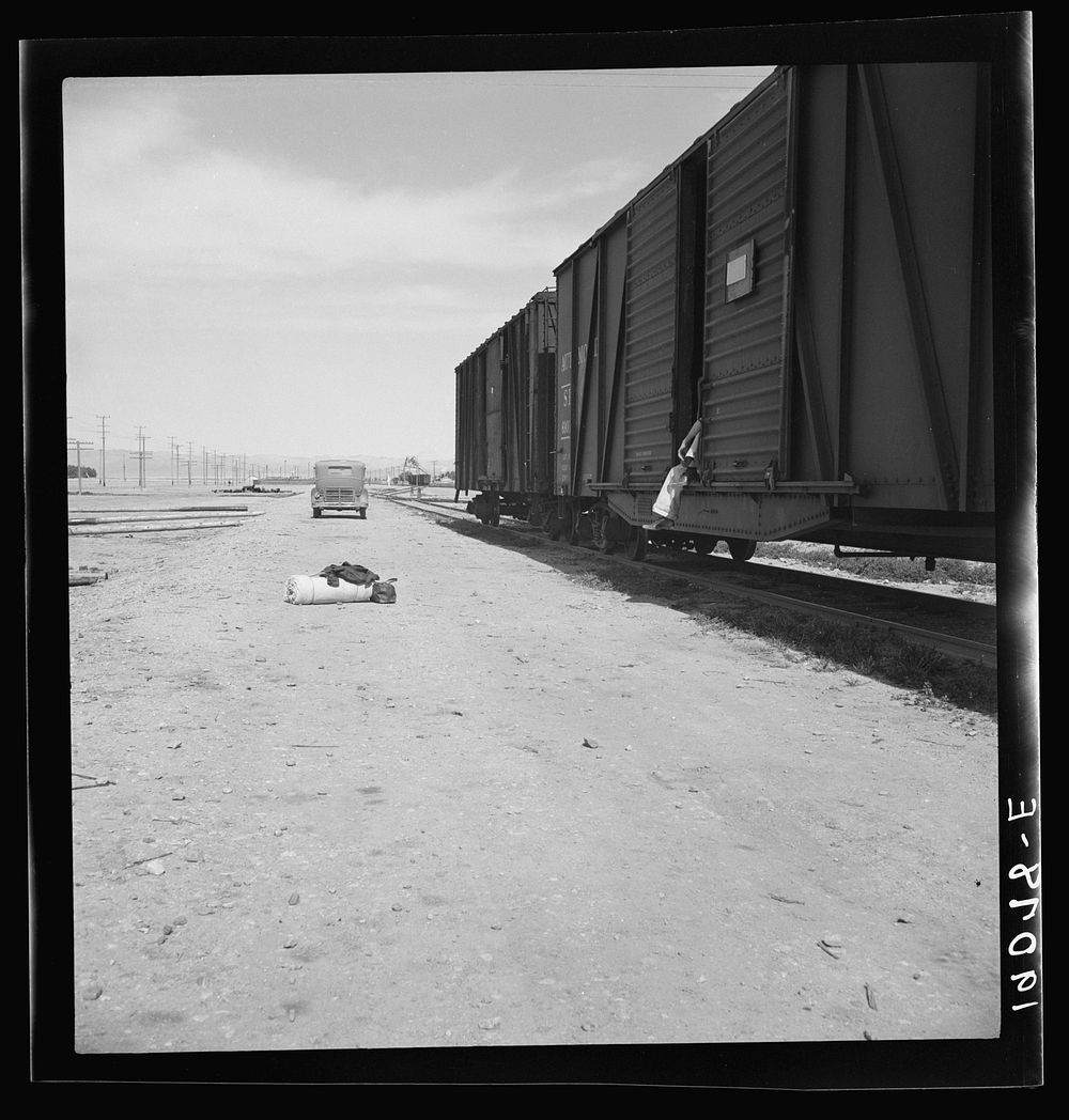 [Untitled photo, possibly related to: Car on siding across tracks from pea packing plant. Twenty-five year old itinerant…