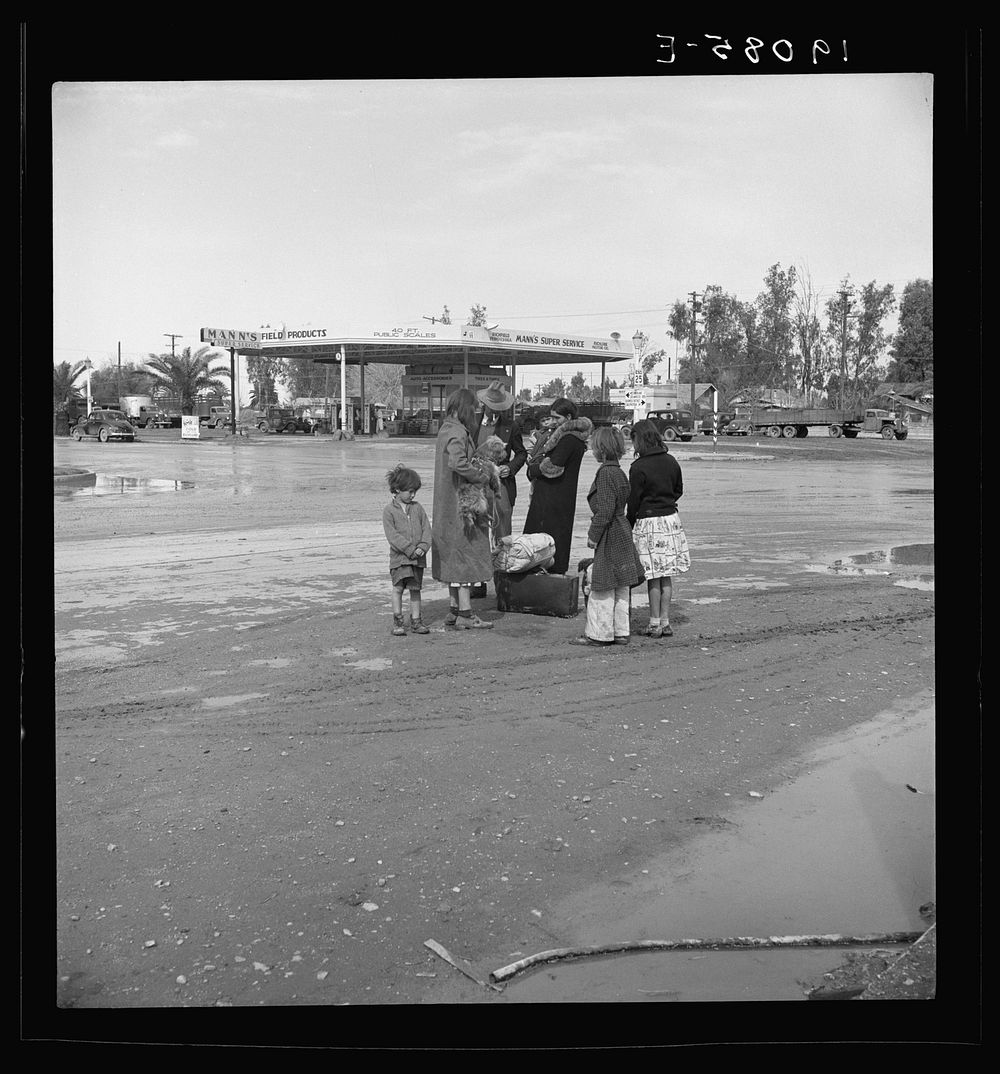 [Untitled photo, possibly related to: After a lift of five miles by a passing motorist, the family of homeless, walking…