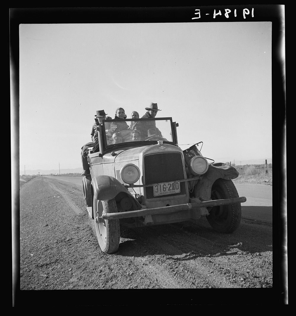 Eight related persons just arriving in this roadster from Texas. In search of employment as pea pickers. On U.S. 80.…