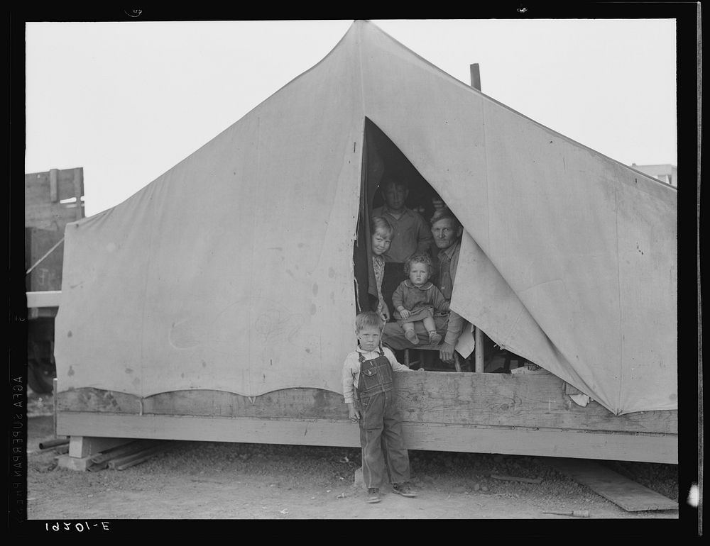 Brawley, Imperial Valley. In Farm Security Administration (FSA) migratory labor camp. Family of mother, father and eleven…