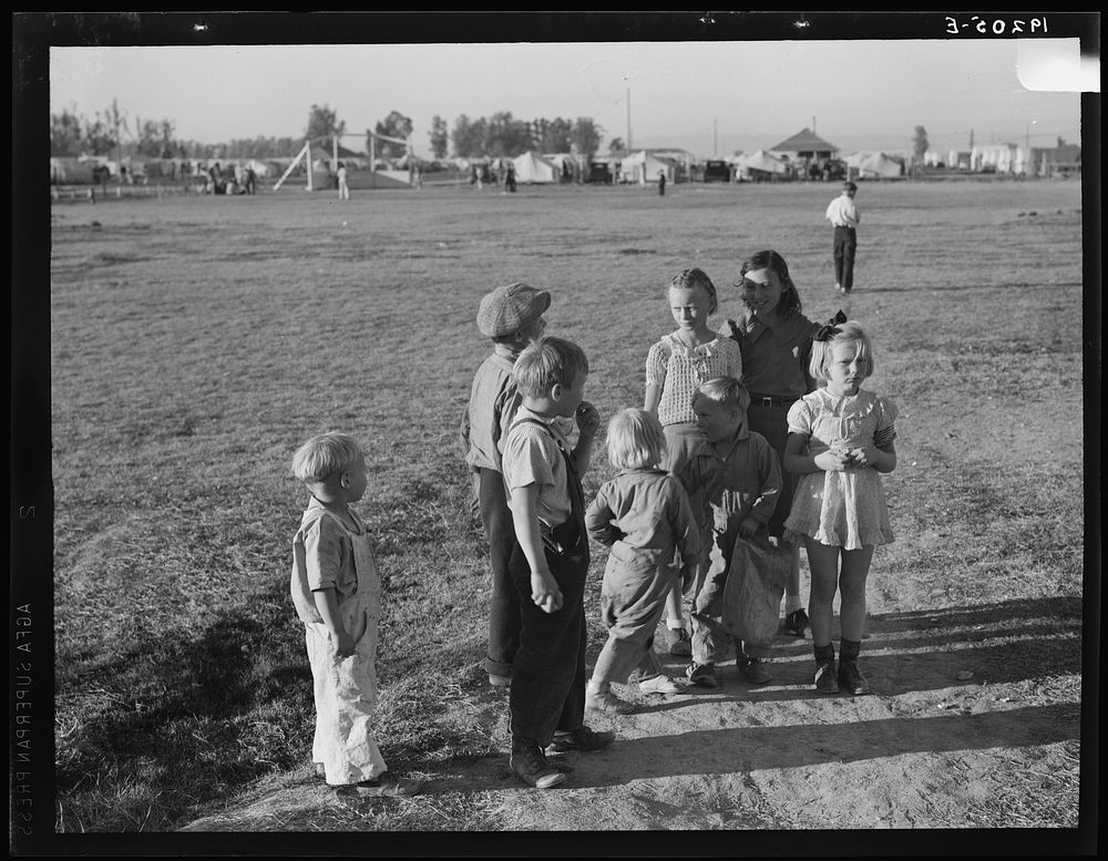 Children of migratory pea pickers in Brawley camp. California. See 19038. Sourced from the Library of Congress.