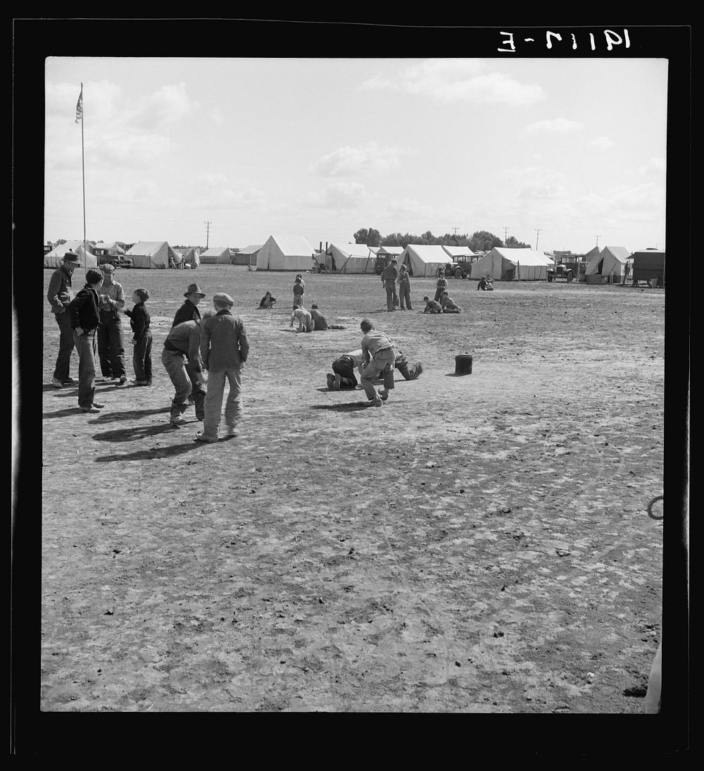 [Untitled photo, possibly related to: Marble time in Farm Security Administration (FSA) migratory labor camp (emergency.)…