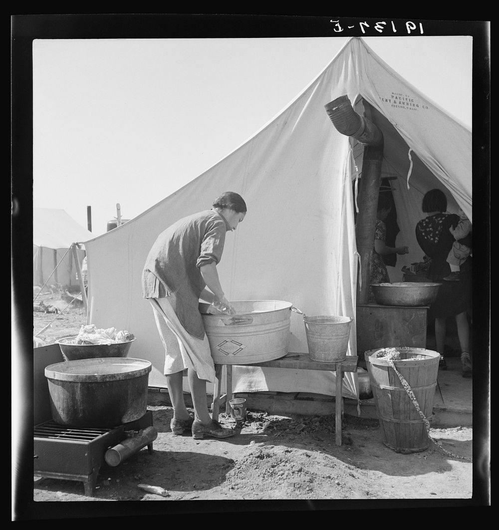 [Untitled photo, possibly related to: Pea picker camp. This family had been farm owners in Oklahoma, lost their farm and for…