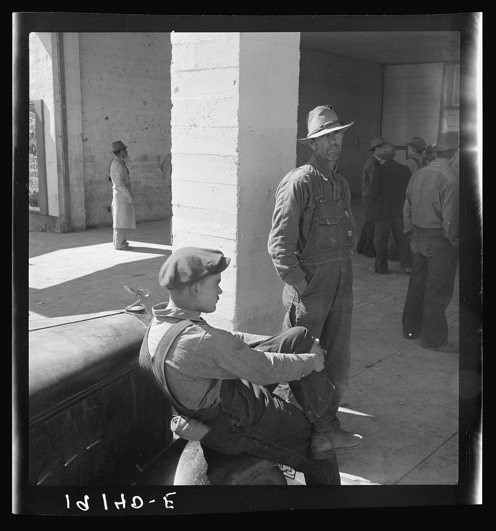 Pea pickers waiting at Farm Security Administration (FSA) office for issue of surplus commodities. Calipatria, California.…