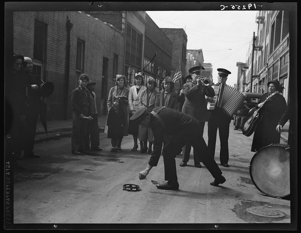 Salvation Army, San Francisco, California. Army contributes first to the tambourine (two dollars), outside contribution…