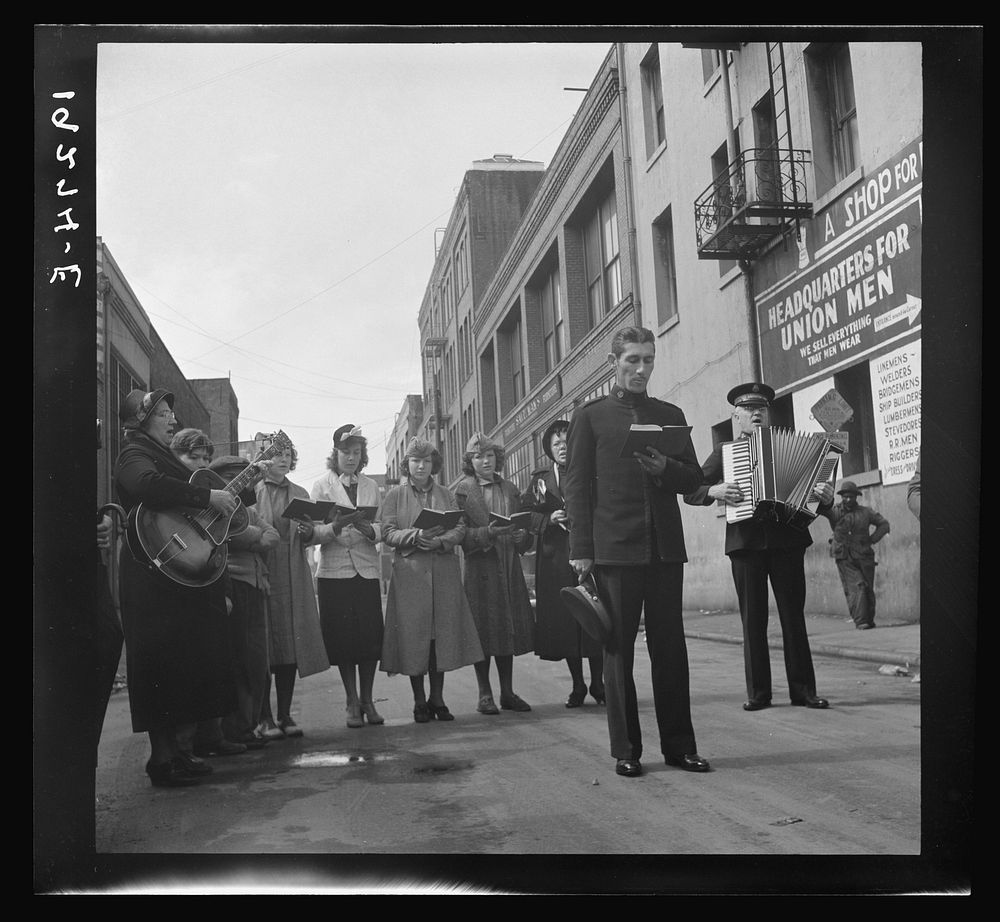 At Minna Street the army forms a semi-circle and sings to attract a crowd. Salvation Army, San Francisco, California.…