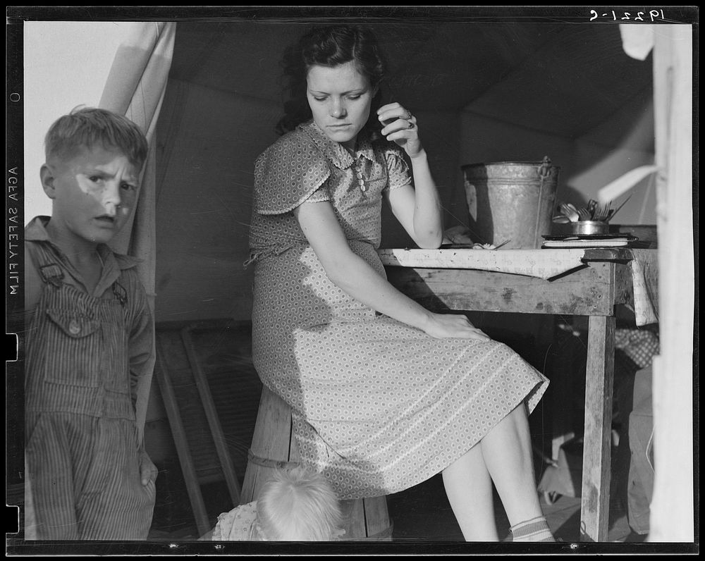 Calipatria, Imperial Valley, In Farm Security Administration (FSA) emergency migratory labor camp. Daughter of ex-tenant…
