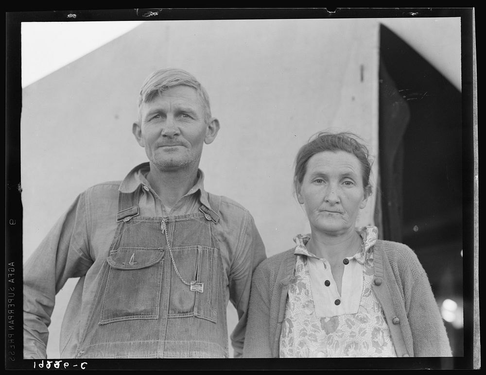 In Farm Security Administration (FSA) migratory labor camp. Family, mother, father and eleven children, originally from…
