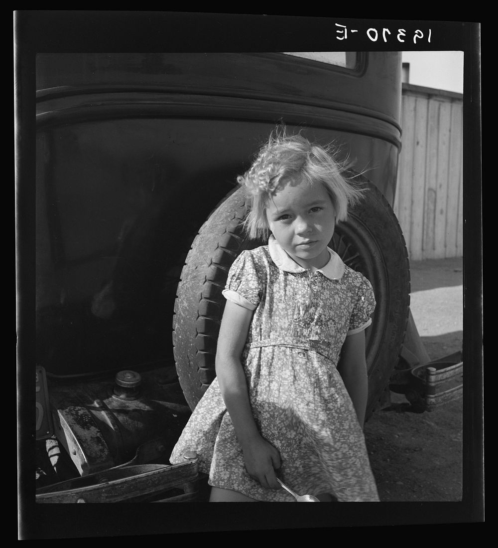 Arkansas girl in migrant camp near Greenfield, Salinas Valley, California. This is an Arkansawyers auto camp, filled almost…