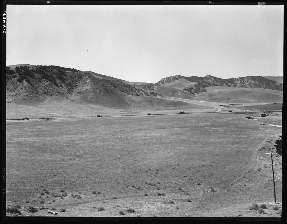 U.S. 99 on ridge over Tehachapi Mountains. Heavy truck route between Los Angeles and San Joaquin Valley over which migrants…