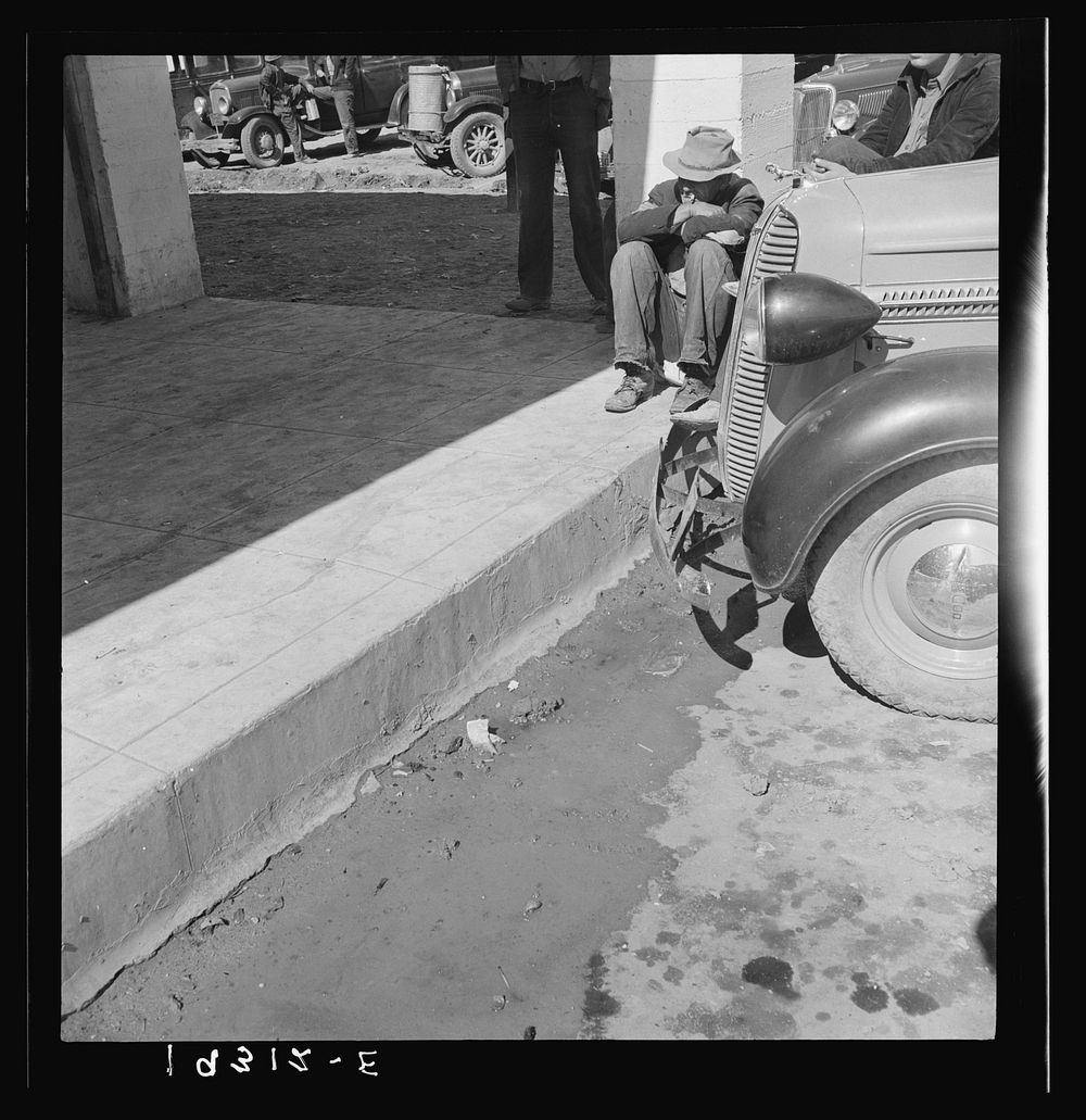 Outside Farm Security Administration (FSA) grant office during the pea harvest. Calipatria, California. During the spring of…