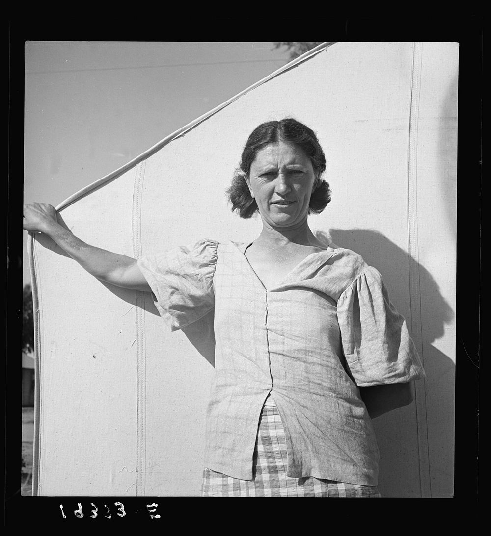 In a carrot pickers' camp, Imperial Valley, California. Woman from Broken Bow, Oklahoma. "Are you going to take my picture…