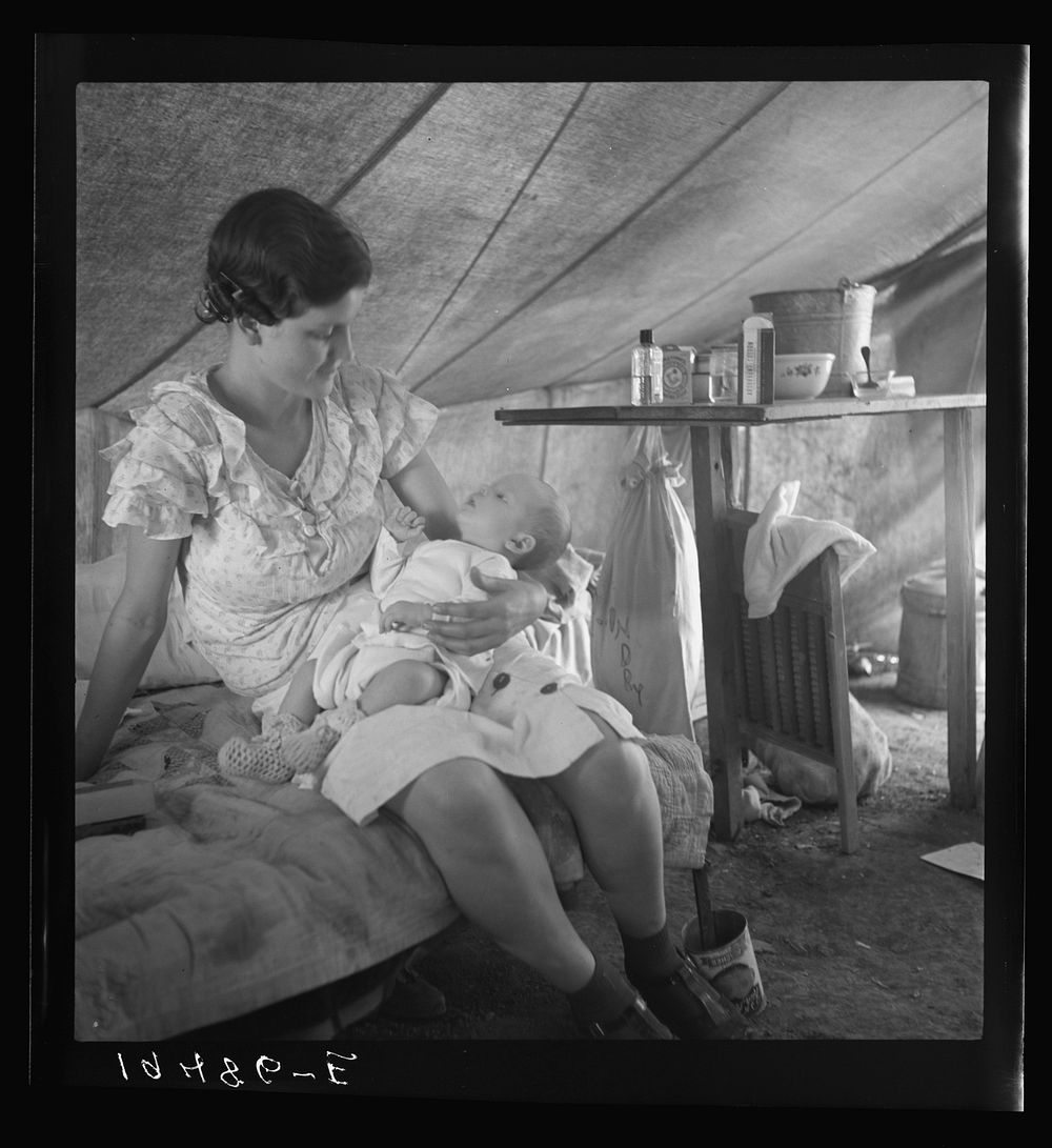 Young migrant mother with six weeks old baby born in a hospital with aid of Farm Security Administration (FSA) medical and…