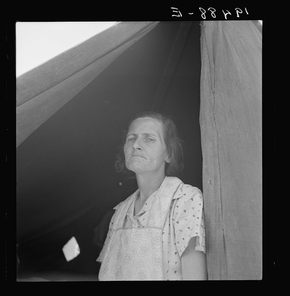 Migrant woman from Arkansas living in contractor's camp near Westley, California. She would prefer to live in a government…