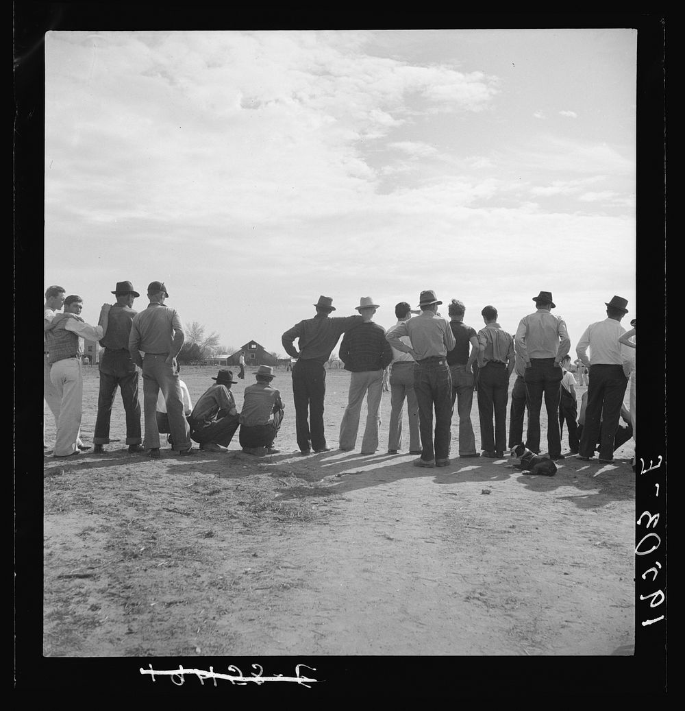 Watching ball game. Shafter camp for migrants. California by Dorothea Lange