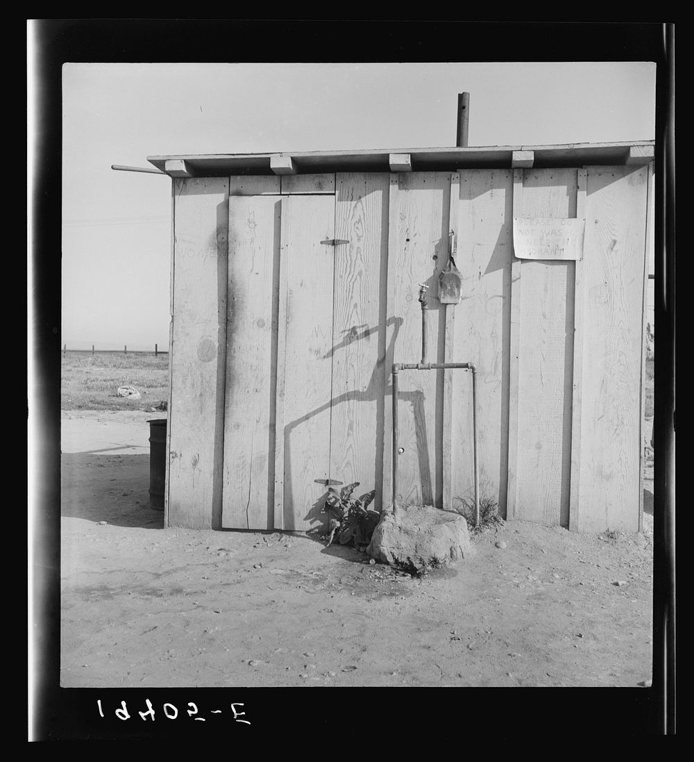 Water supply for ten cabins in Arkansawyers auto camp. Greenfield, Salinas Valley, California. Sourced from the Library of…