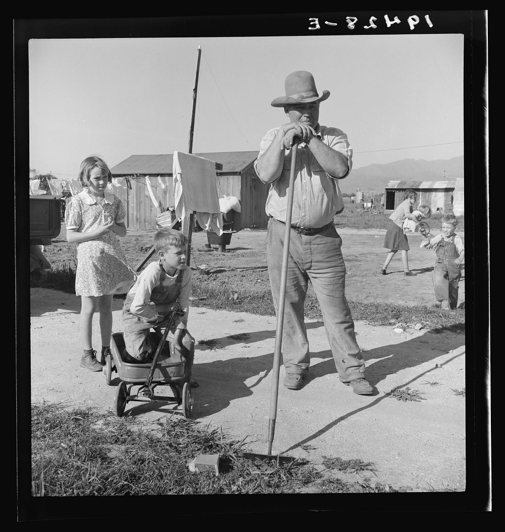 Outskirts of Salinas, California. Rapidly growing settlement of lettuce workers. Family from Oklahoma settling in makeshift…