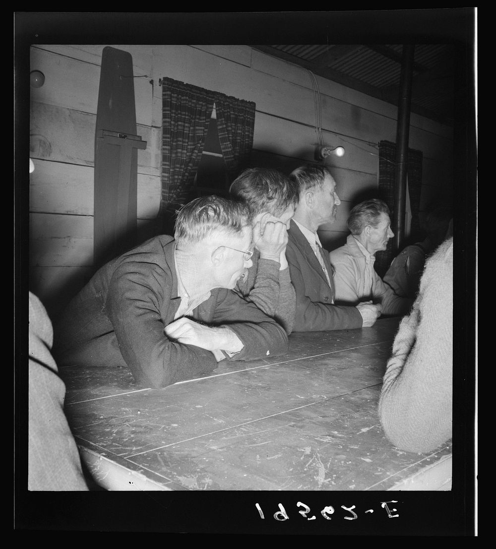 Farm Security Administration (FSA) camp for migratory agricultural workers. Farmersville, California. Meeting of the camp…