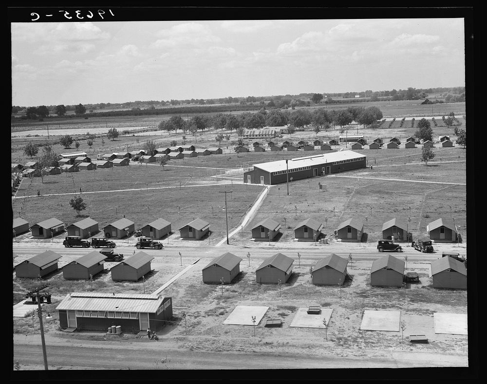 Tulare County. View of Farm Security Administration (FSA) camp for migratory laborers. Farmersville. Seen from water tower…