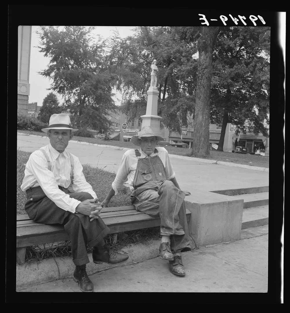Person County. Farmer in town idling around the county courthouse. Note Confederate monument characteristic of Southern…