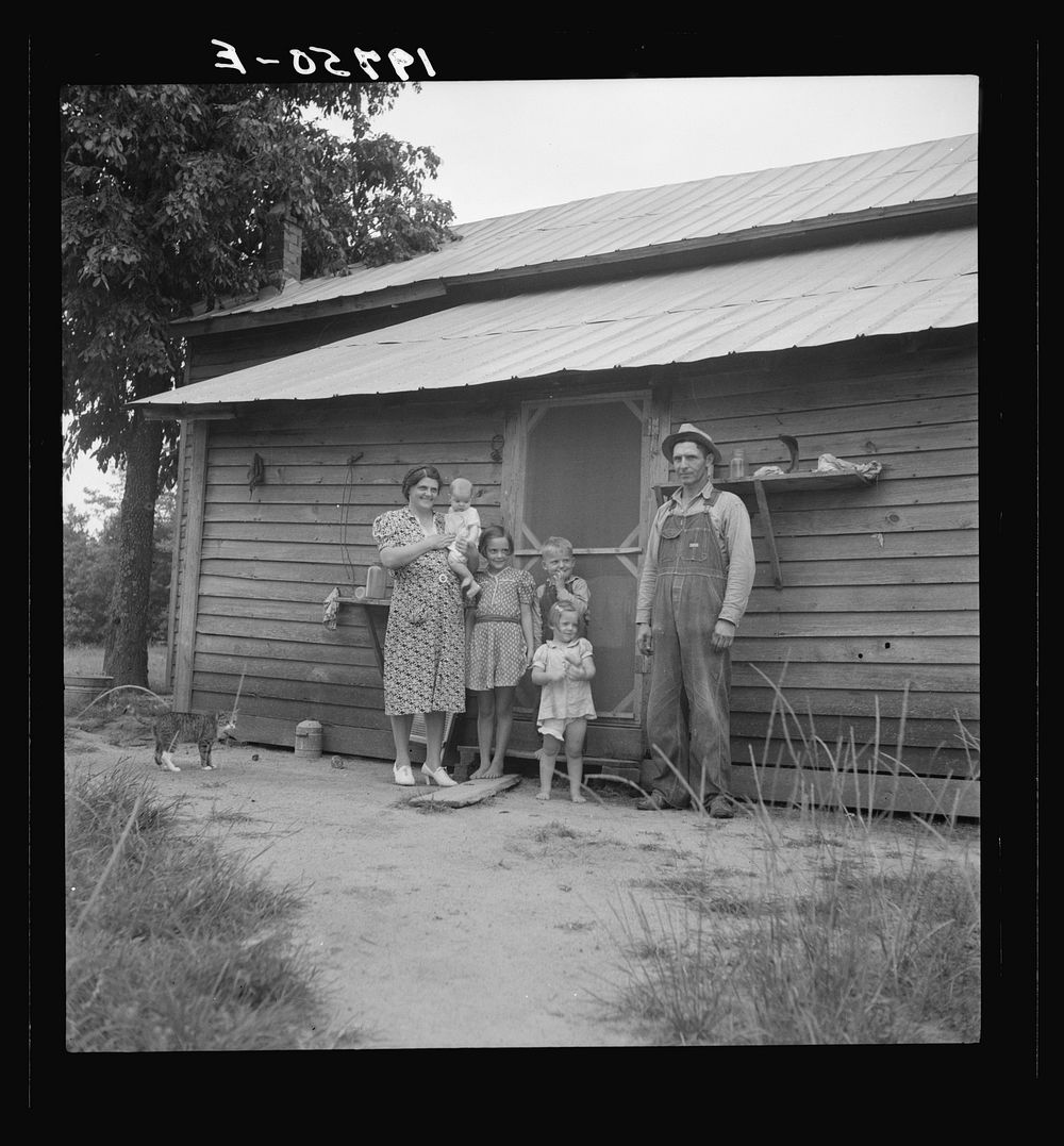 [Untitled photo, possibly related to: Tobacco sharecropper with his oldest daughter. Person County, North Carolina]. Sourced…