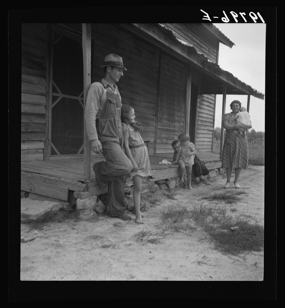 [Untitled photo, possibly related to: Tobacco sharecropper with his oldest daughter. Person County, North Carolina]. Sourced…