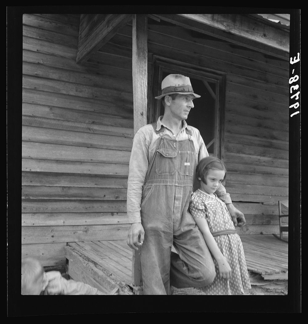 Tobacco sharecropper with his oldest daughter. Person County, North Carolina. Sourced from the Library of Congress.
