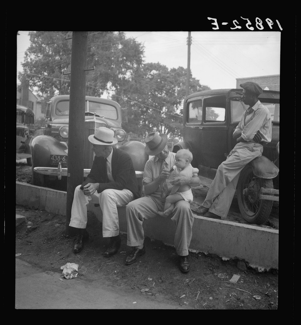 Chatham County farmers in town on Saturday afternoon. Pittsboro, North Carolina. Sourced from the Library of Congress.
