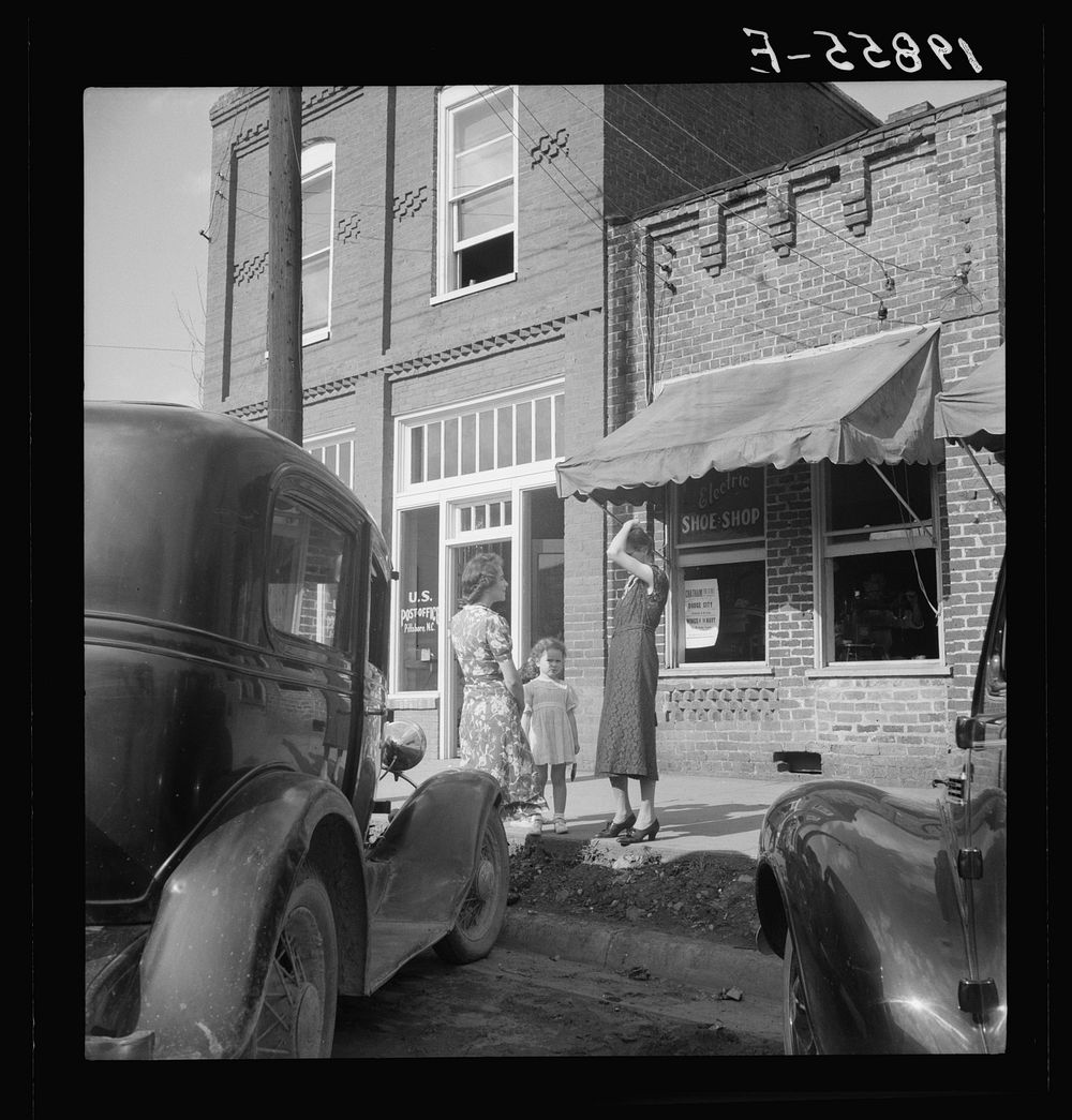 Street encounter on a Saturday afternoon. Pittsboro, North Carolina. Sourced from the Library of Congress.