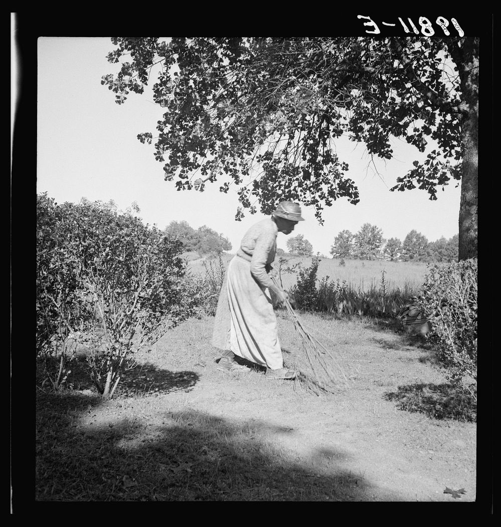 Caroline Atwater, wife of  owner, has a well-swept yard. Sourced from the Library of Congress.